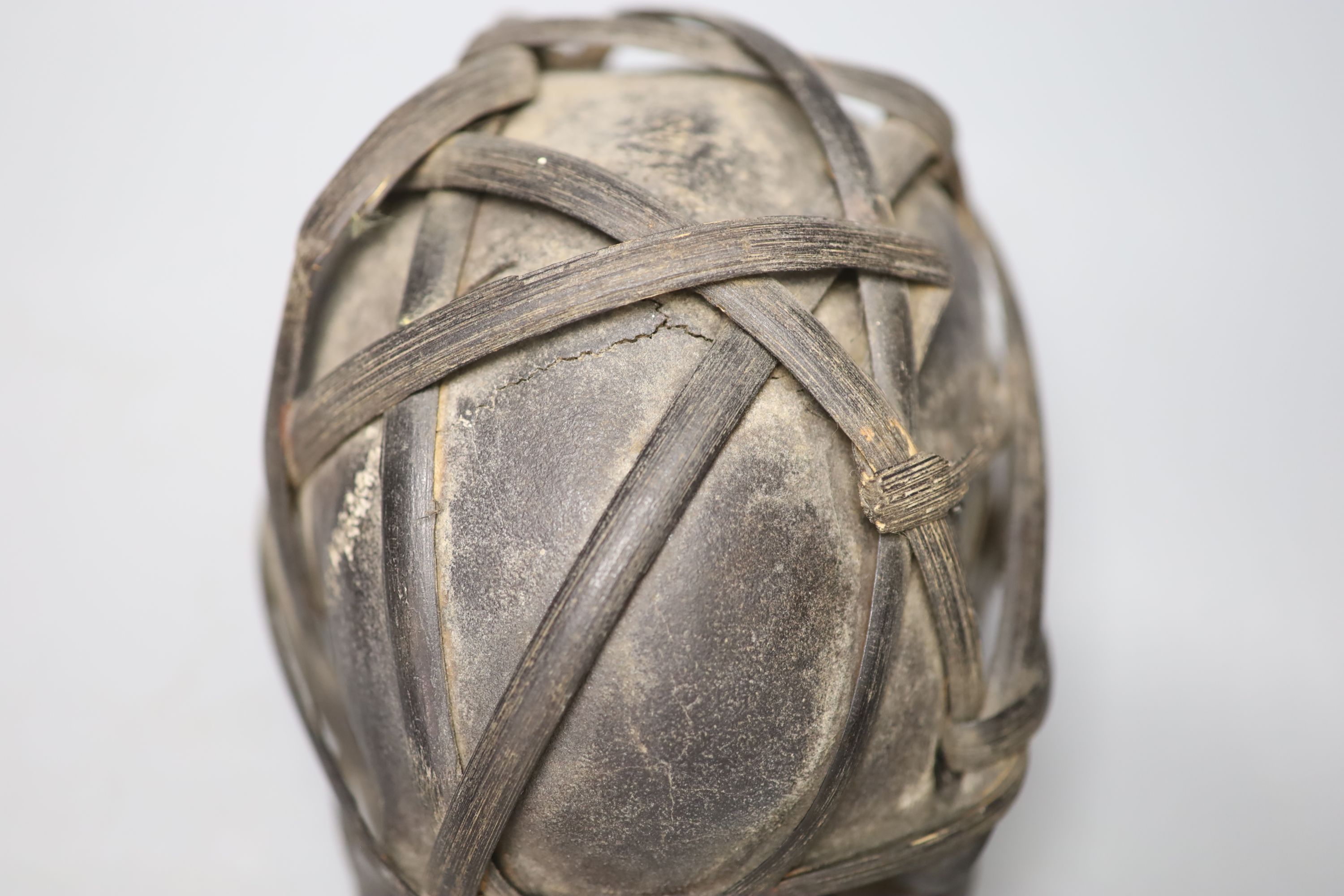 A bound Asmat human skull, possibly head hunters